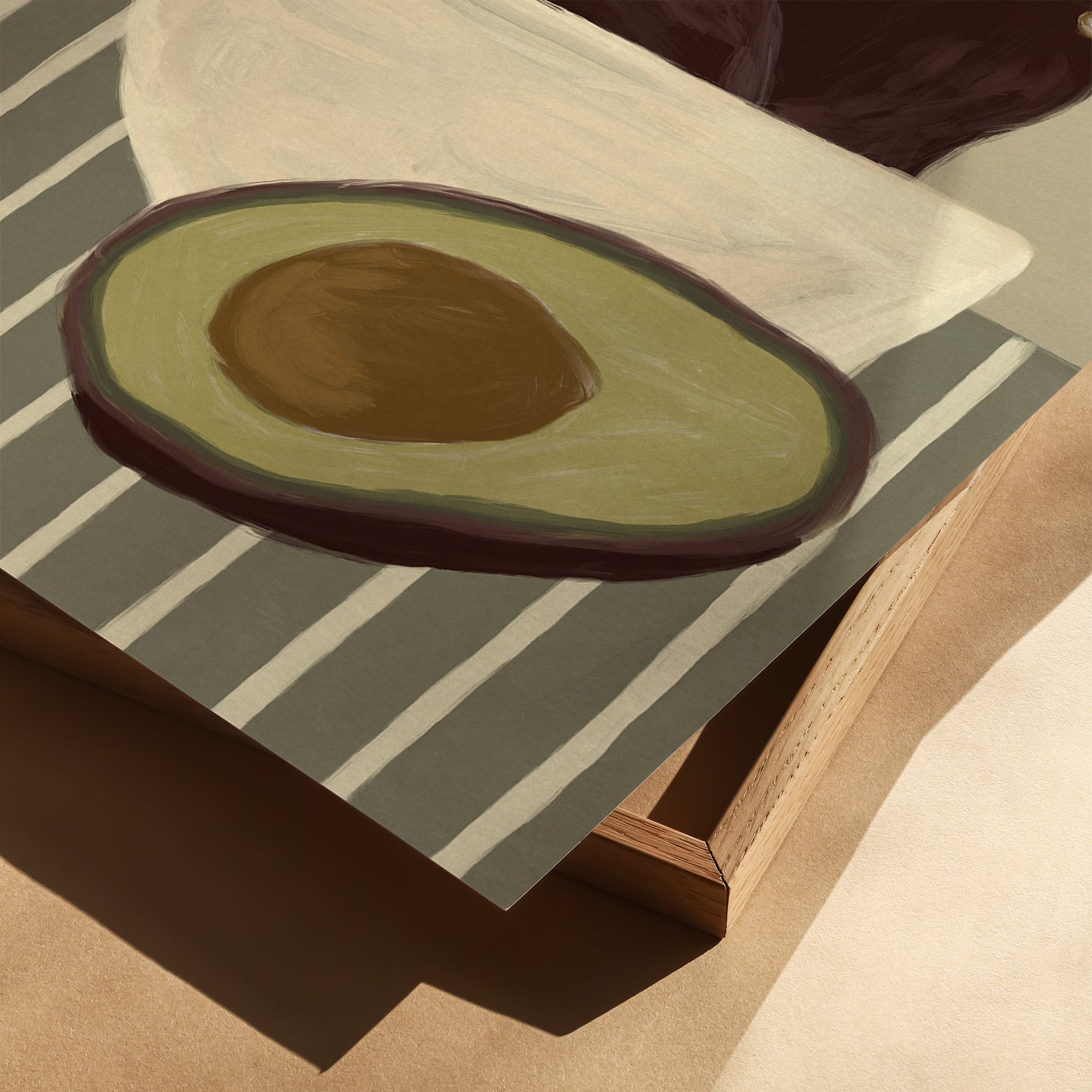 Detail of avocado wall art print with bold fruit illustration, contemporary still life poster for modern kitchen decor.