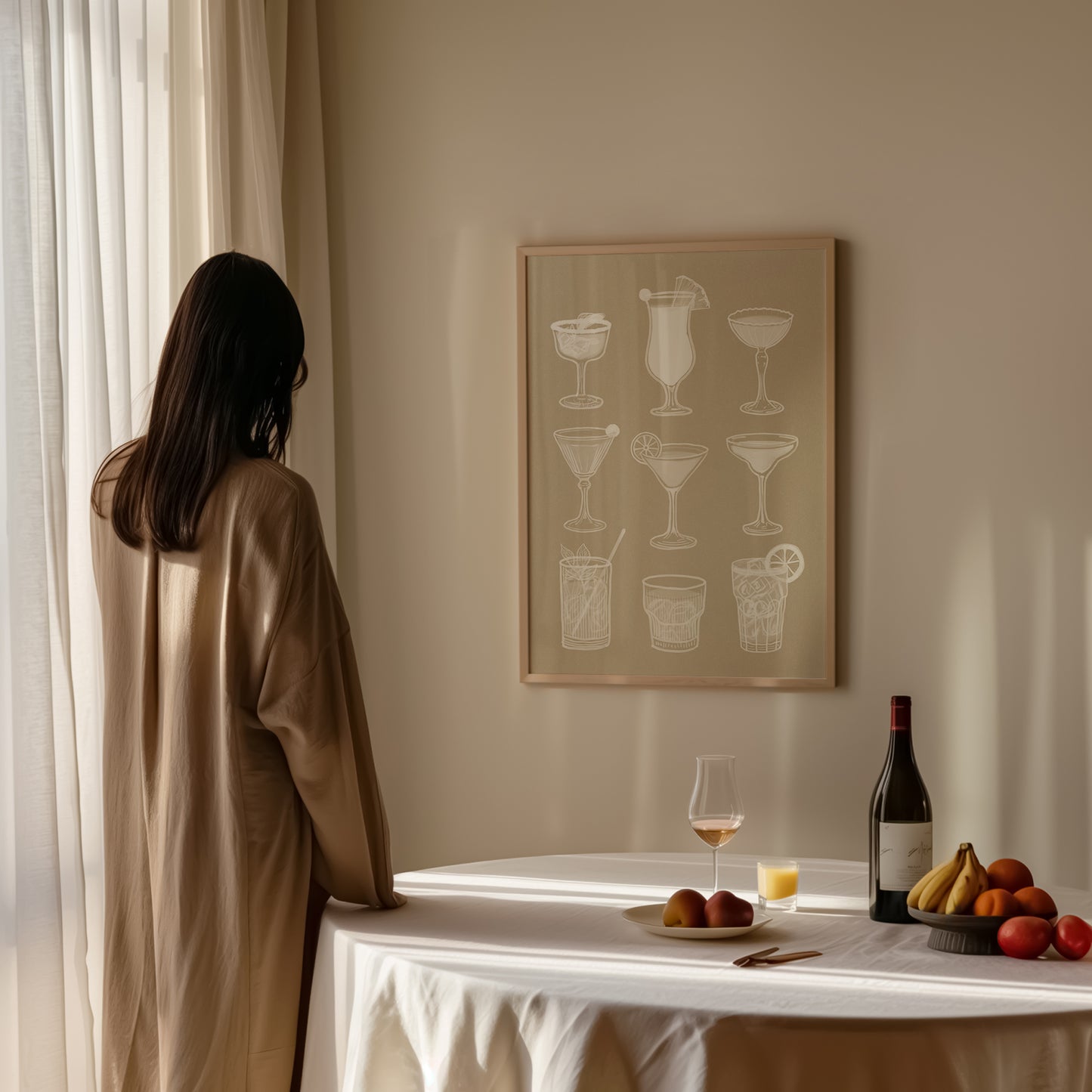Cocktail glasses wall art print in neutral tones, minimalist drinks poster styled in dining room with wine and fruit.