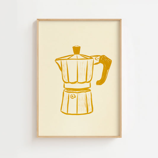 A framed print of a yellow moka pot against a white background, with a matte finish.