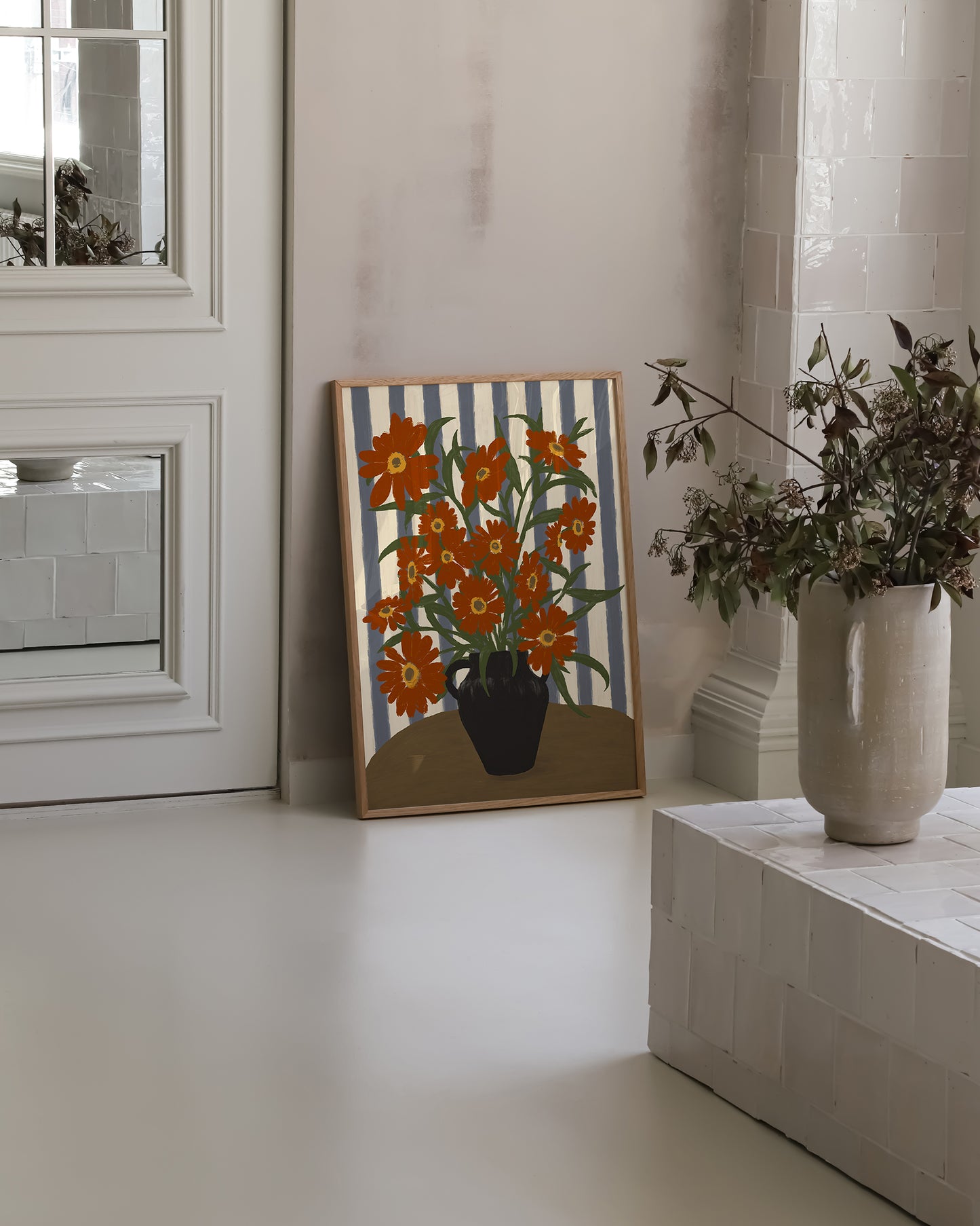 Framed orange flowers art print styled in modern interior, botanical wall art poster for living room or hallway decor.