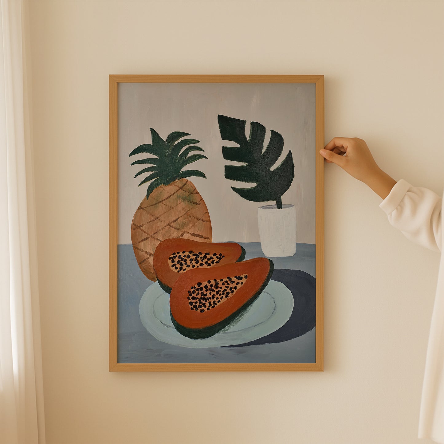 Framed papaya and pineapple tropical wall art – modern still life art print with warm tones, ideal for kitchen or coastal home decor.