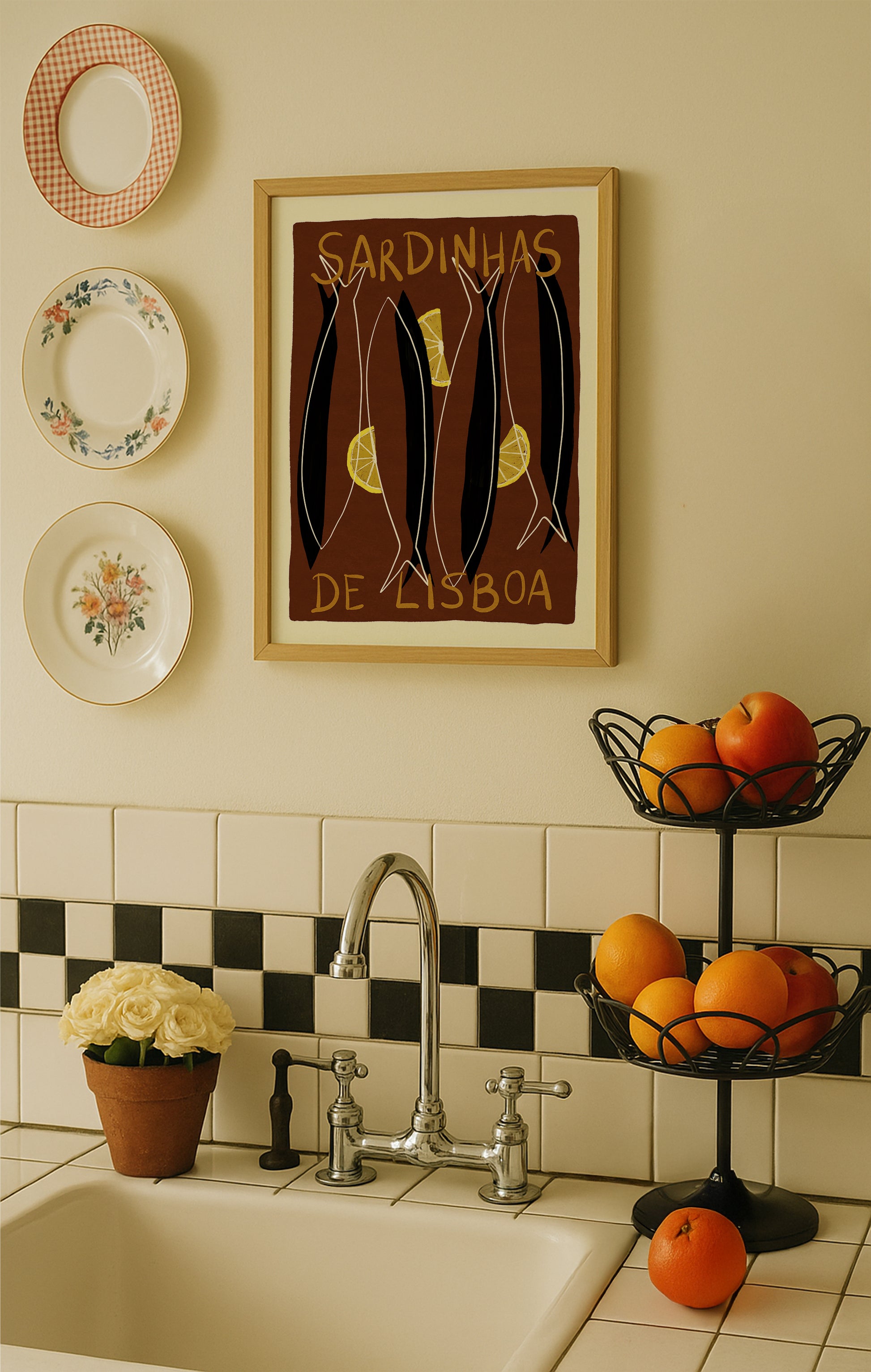 Kitchen with a sink, decorative plates, and a framed picture on the wall.
