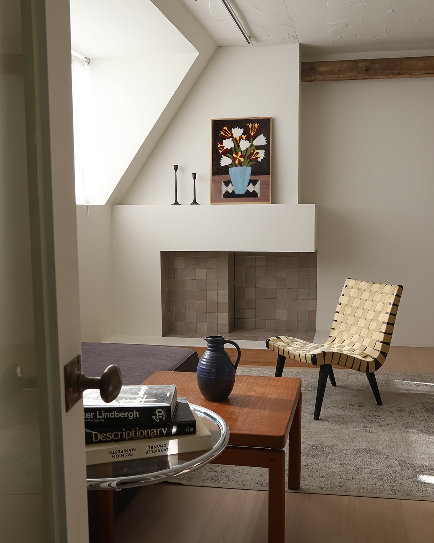 Framed tulip bouquet wall art displayed above a fireplace in a mid-century modern living room. Floral art print adds warmth and vintage charm to neutral interiors.