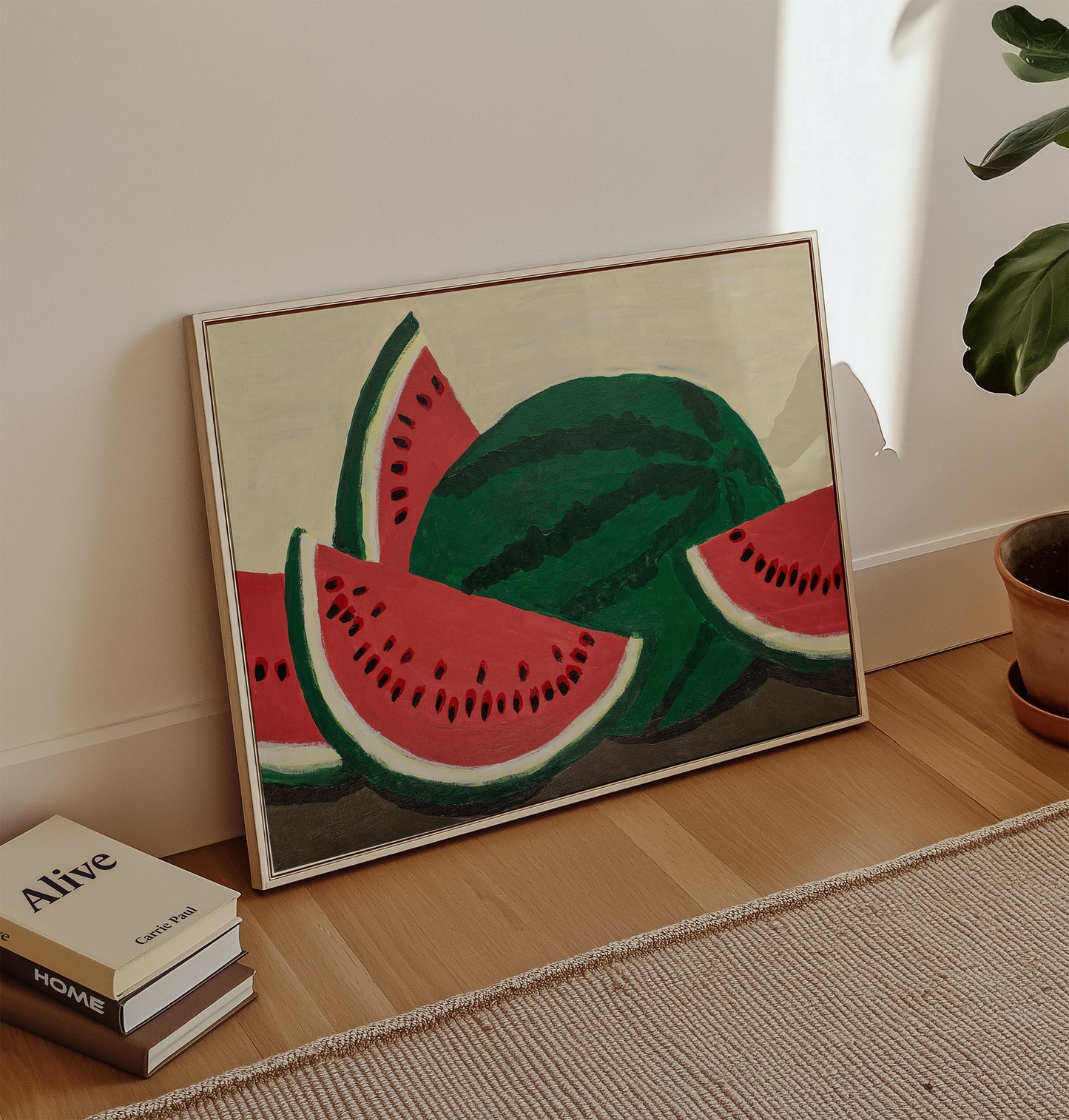 Watermelon acrylic painting art print leaning against a wall in a bright living space – colorful fruit wall art for summer kitchen or dining room decor.