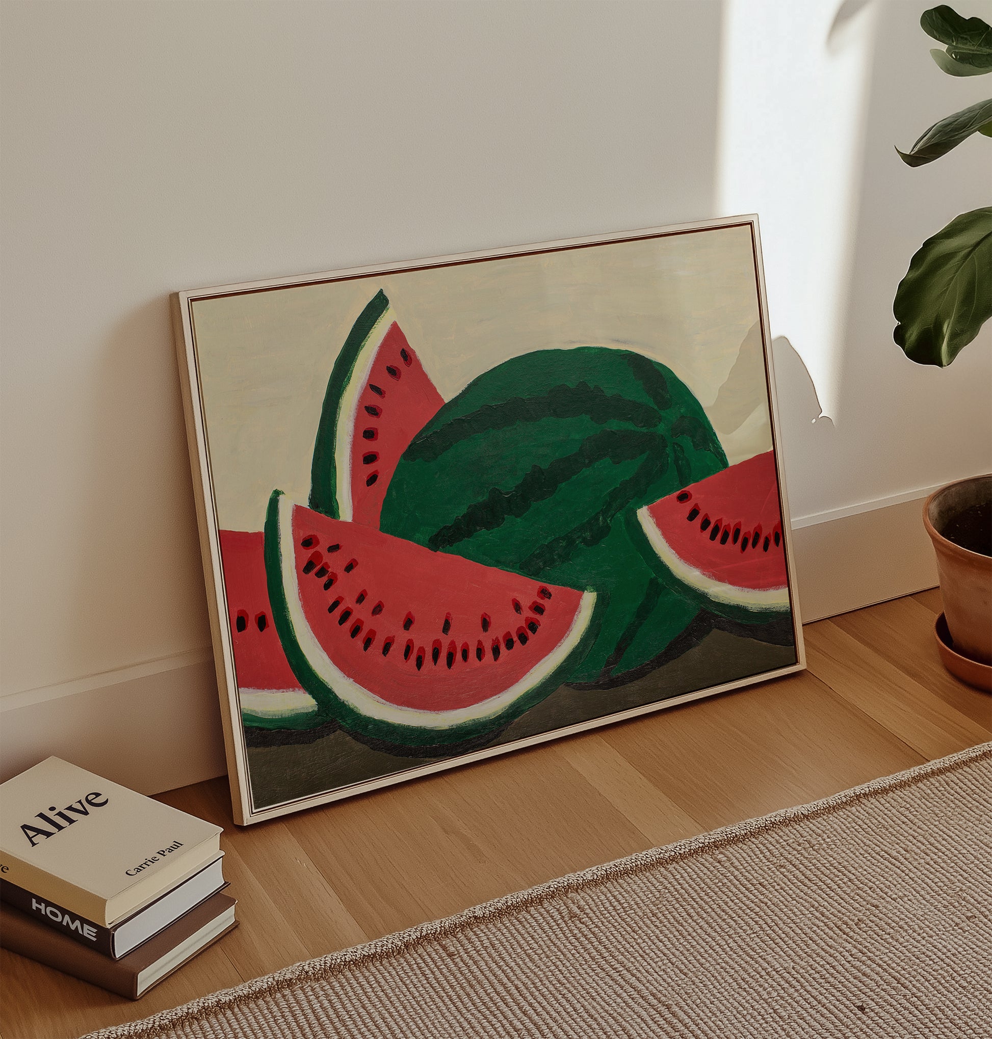 Watermelon acrylic painting art print leaning against a wall in a bright living space – colorful fruit wall art for summer kitchen or dining room decor.