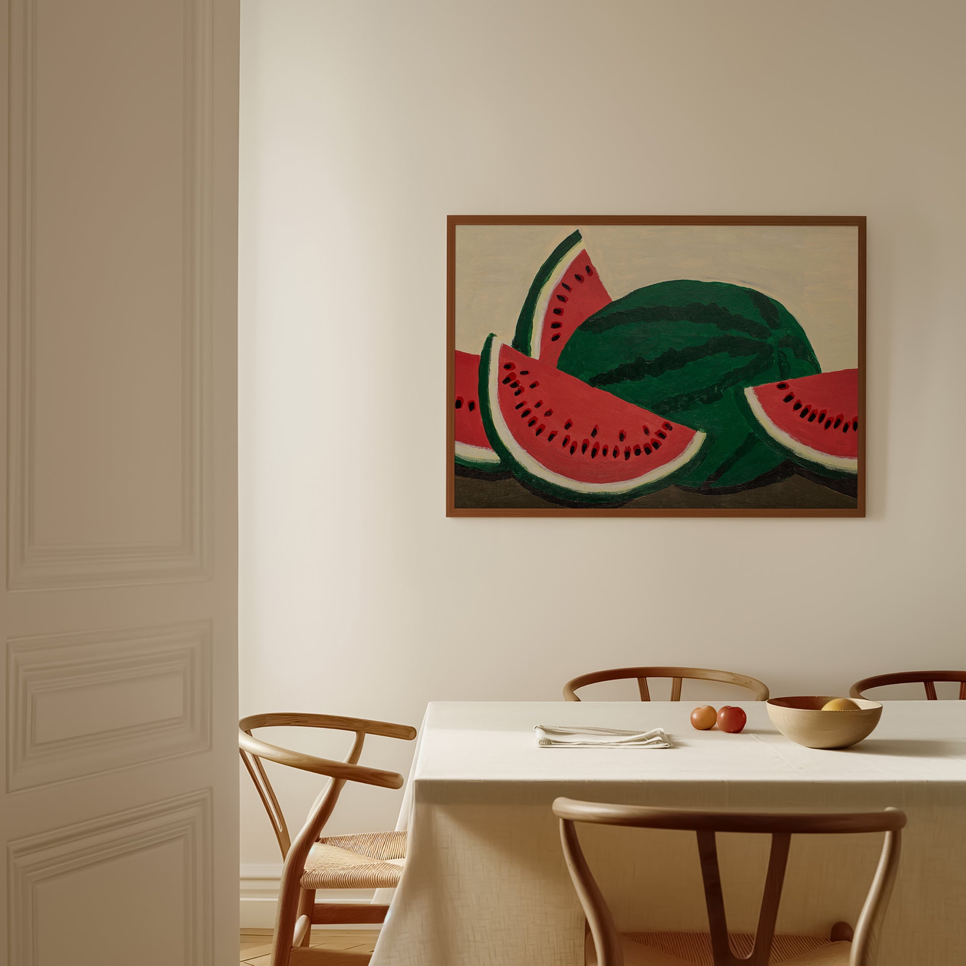 Framed watermelon acrylic painting art print hanging above a dining table – modern fruit wall art for kitchen or breakfast area decor.